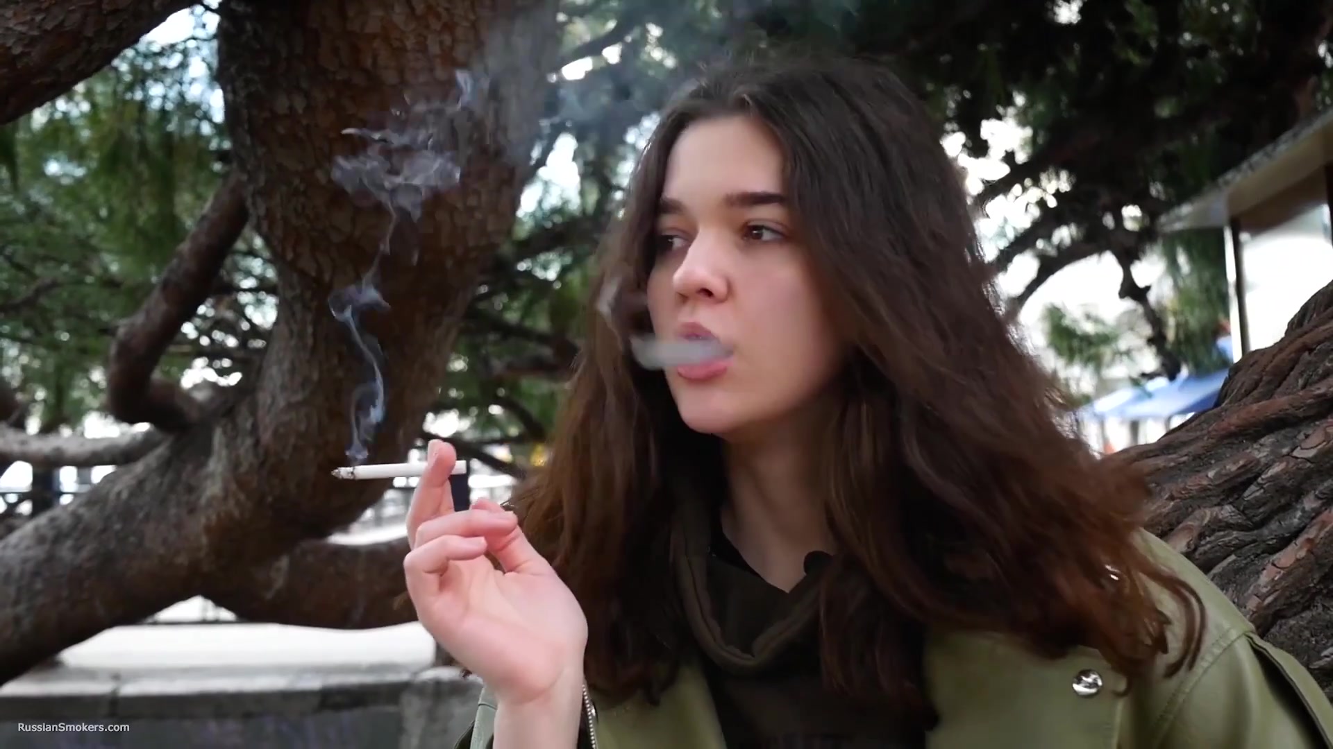 Young Brunette Is Taking An Unhurried Stroll With Allwhite 120mm Cigarette