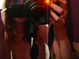 Mirror selfshot made by a naked slim-fit chick