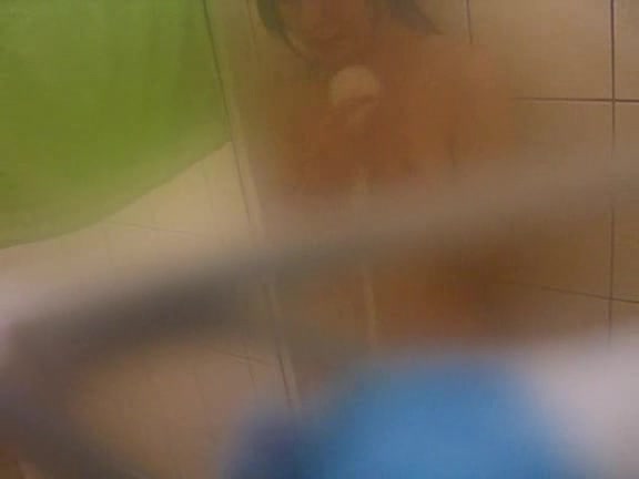Young Asian babe caught naked in the bathroom by horny