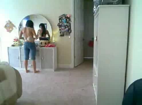 Petite and sexy Japanese babe puts on clothes on the webcam
