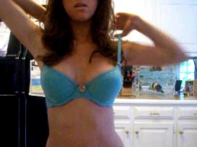 Young busty chick strips in the kitchen, where she belongs