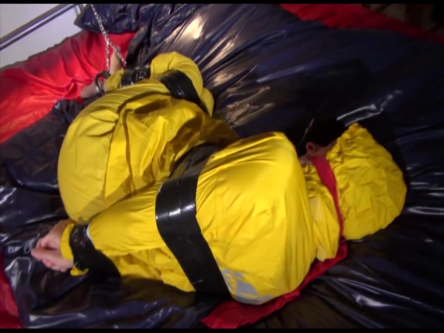 Get 2 Archivevideos With Sonja Enjoying Bondage In Her Shiny Nylon Rainwear