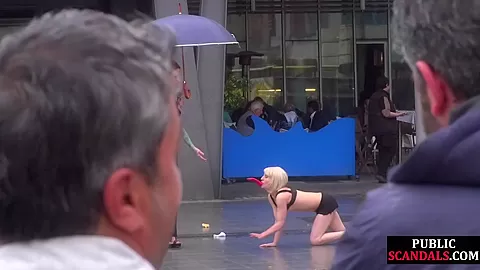Public slut humiliated on the street by her strict domina