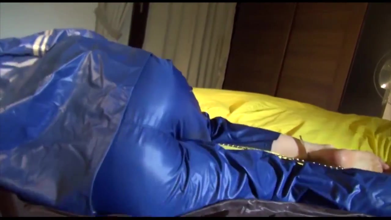 Get 2 Videos With Lucy Bound And Gagged In Her Shiny Nylon Rainwear From Our Archives