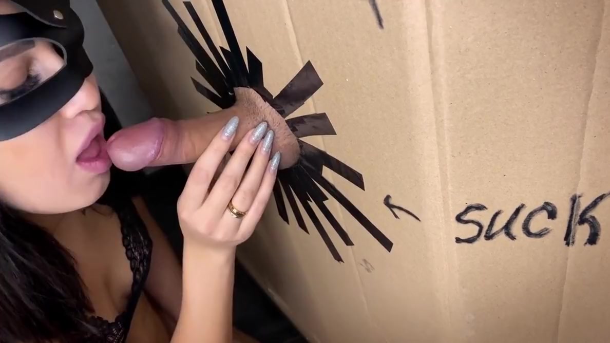 A Hole In The Wall With A Cock And A Girl Sucking A Cock