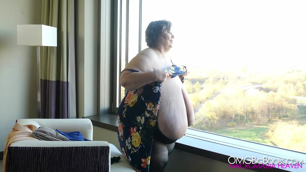 Carla Trying Tops by the Window