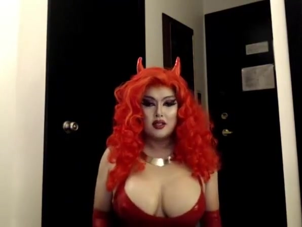 Asian Drag Queen jerks in red Latex