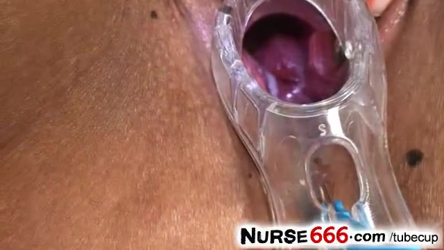 Uniform latina Manuela opens vagina with gyno device