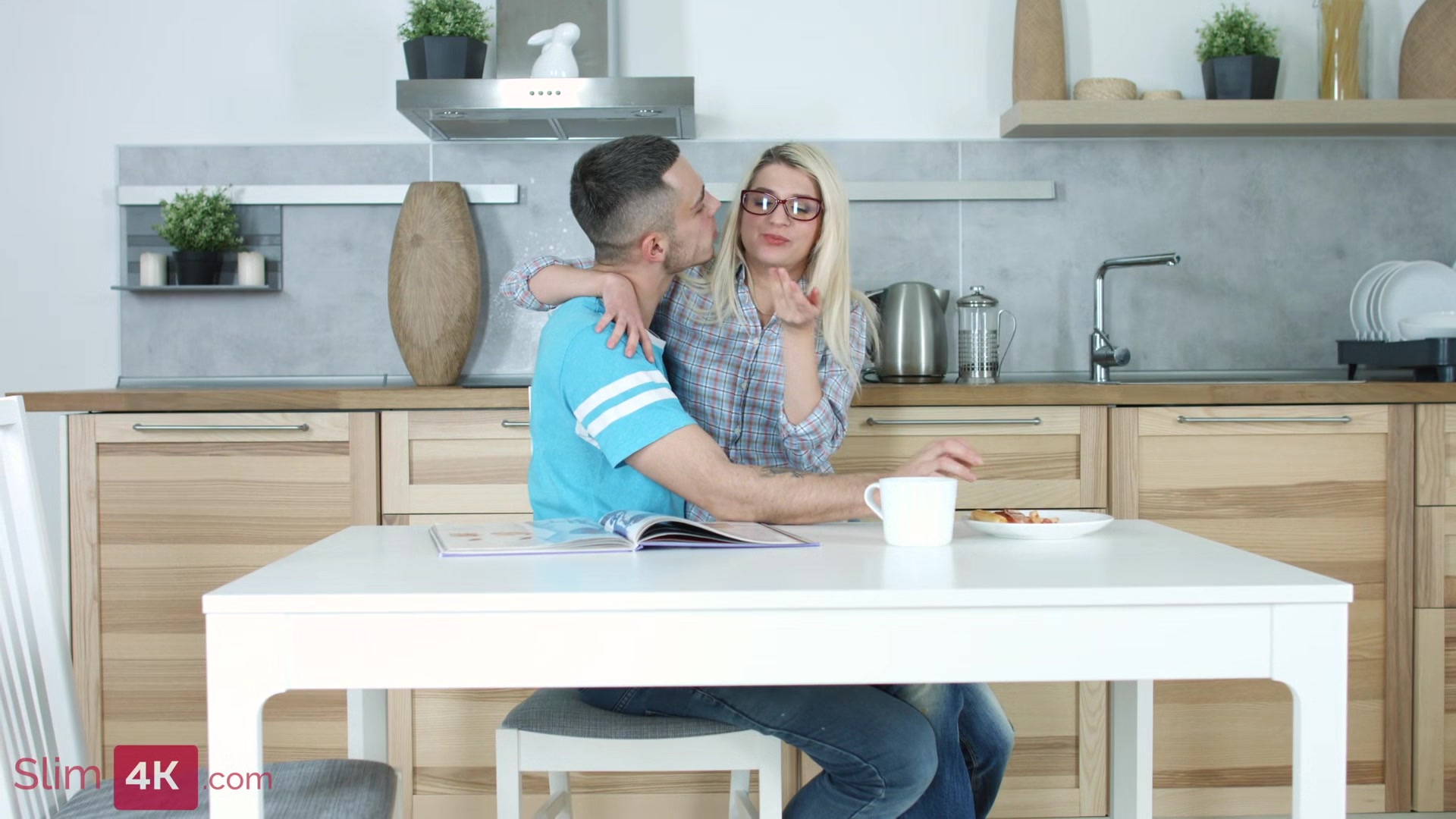 Blond-haired beauty stuffs her face with pizza before getting fucked in the kitchen
