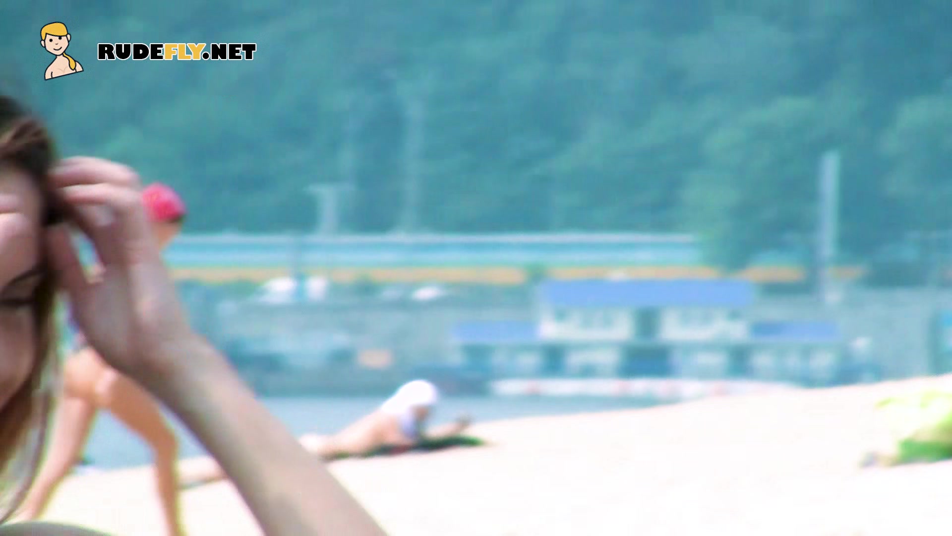 Luscious nude beach girls caught on camera by a while sunbathing