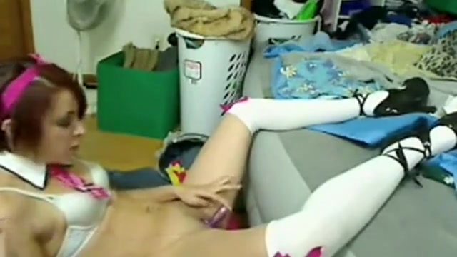 Cute girl spreading her legs and stuffs her pussy with a sex toy