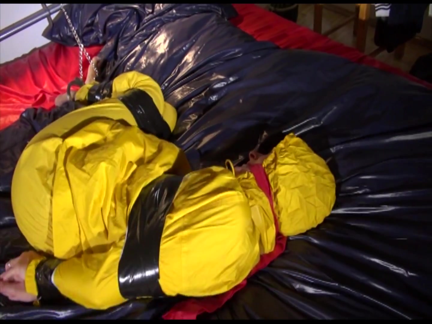 Get 2 Archivevideos With Sonja Enjoying Bondage In Her Shiny Nylon Rainwear