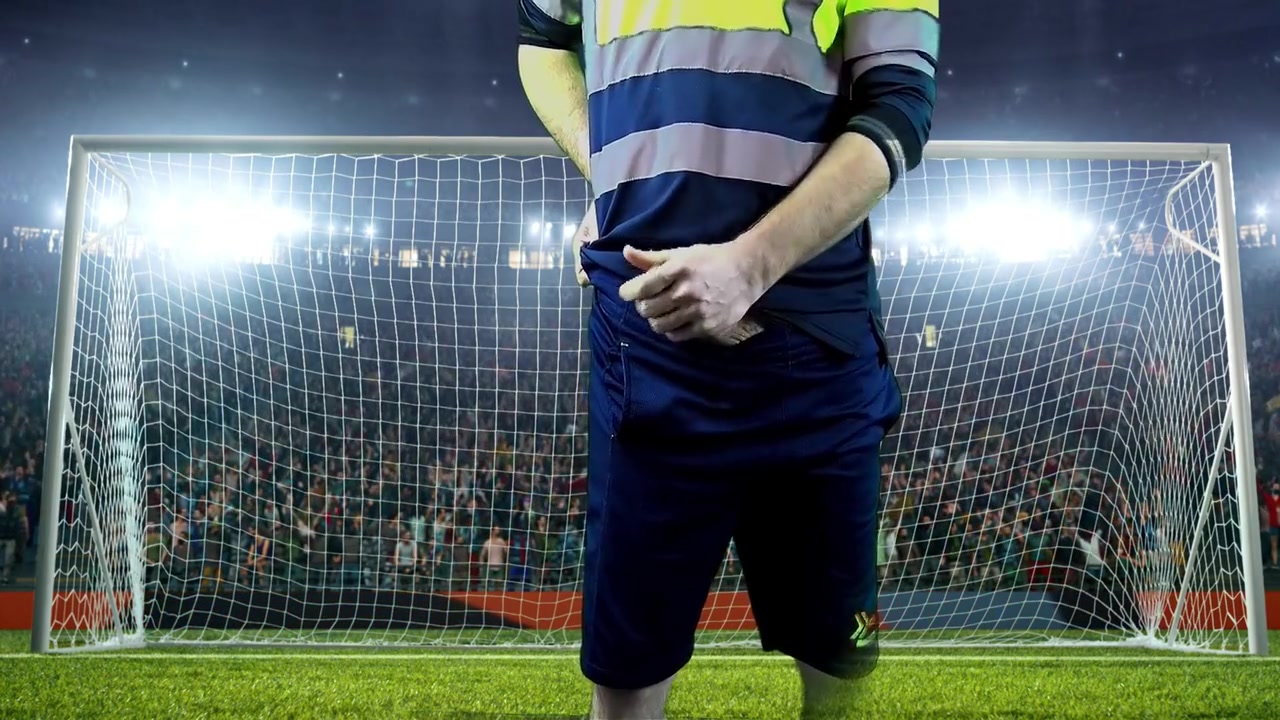 Victorious Goalkeeper Celebrates With Champagne At Big Match