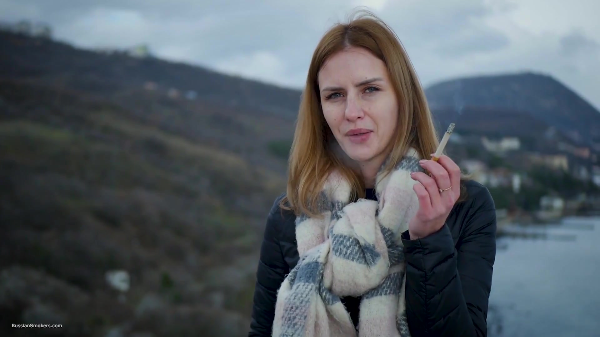 Beautiful Lady Is Smoking Two Saratoga Cigarettes In A Row On A Beautiful View