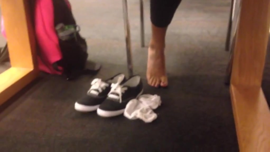 Candid sexy indian feet socks off at library