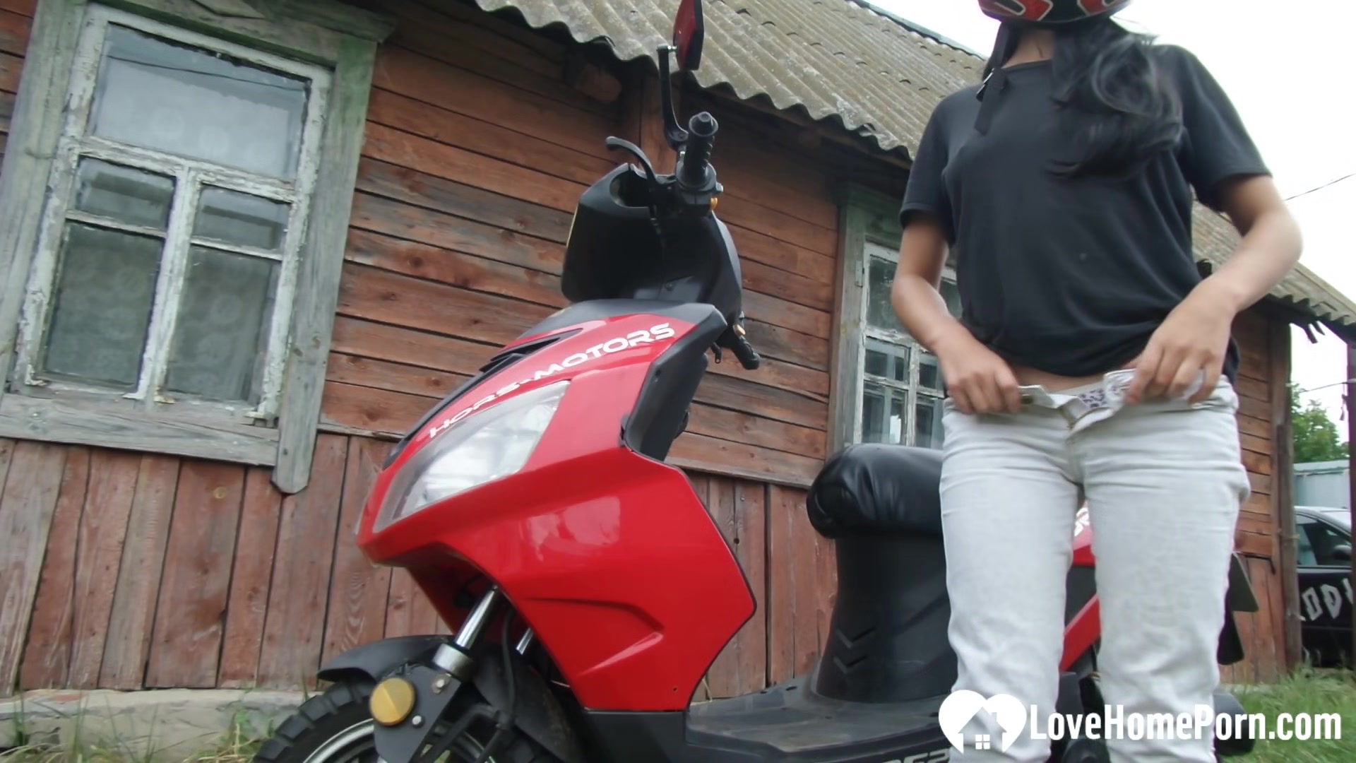 Biker girl masturbates on her red motorcycle