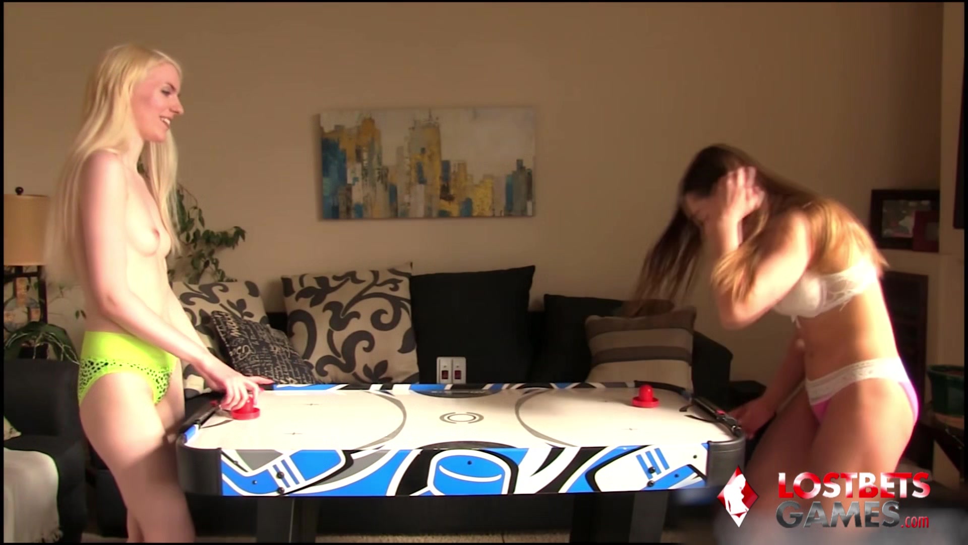 2 hot chicks play strip air hockey, what more can you ask?