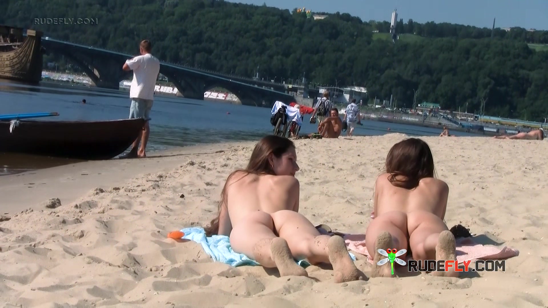 Wicked young nudist enjoys being topless at the beach