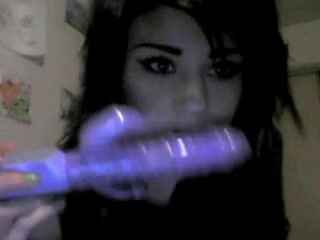 Cute dark-haired chick trying out her new sex toy