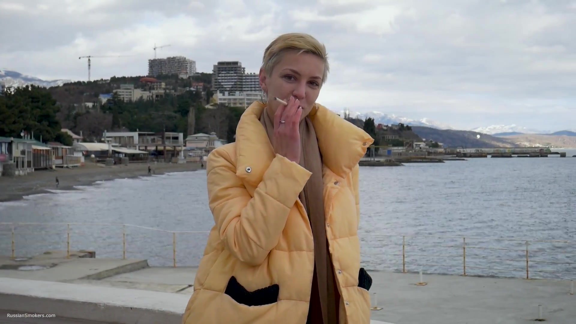 Short Cut Hair Blonde Girl Is Smoking Two Cork Cigarettes