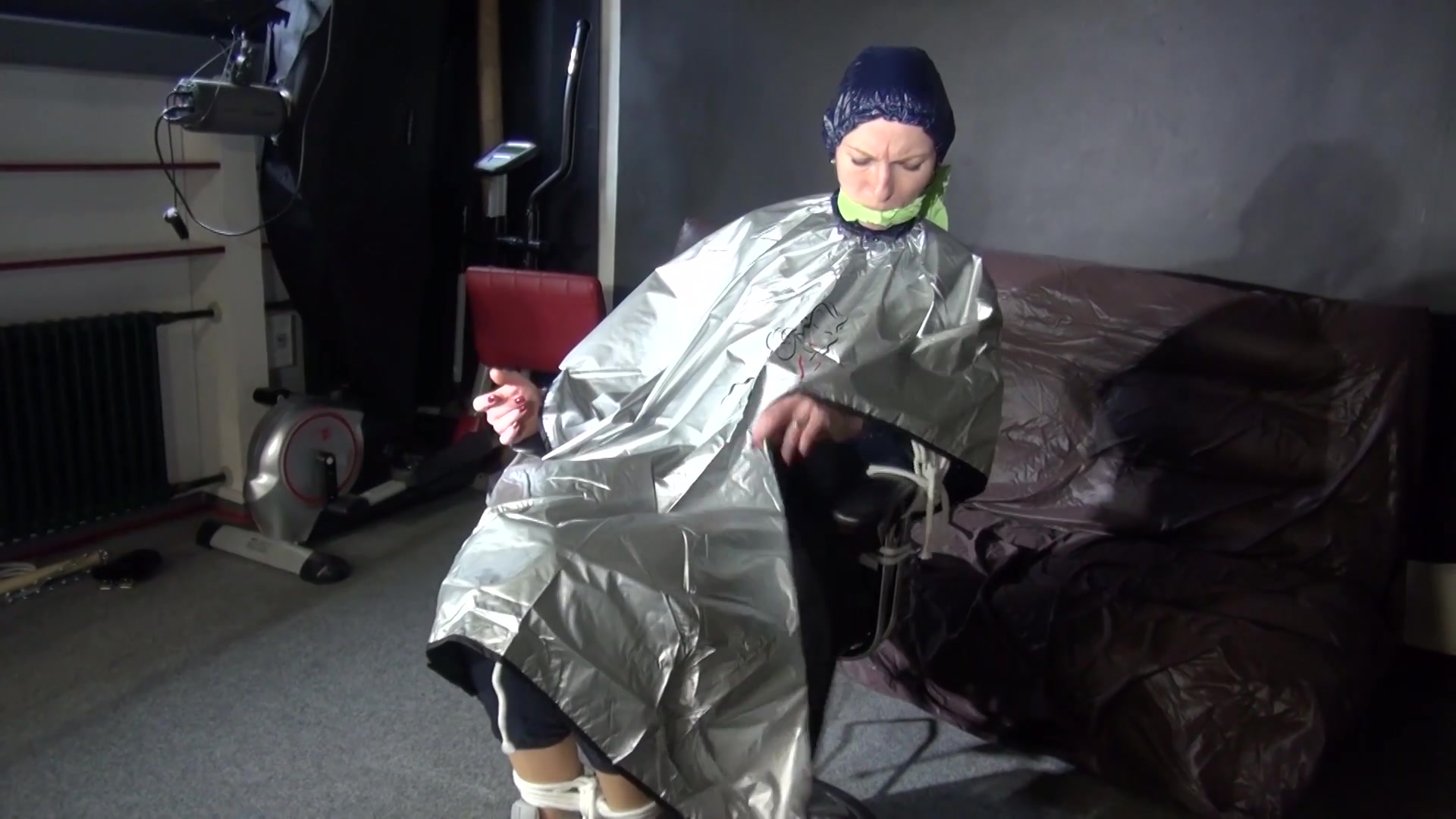 See Ronja Tied And Gagged On A Barber Chair In Shiny Nylon Rainwear And A Shiny Cape!