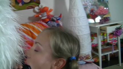 blond with pigtails began to play with a pink marital-device