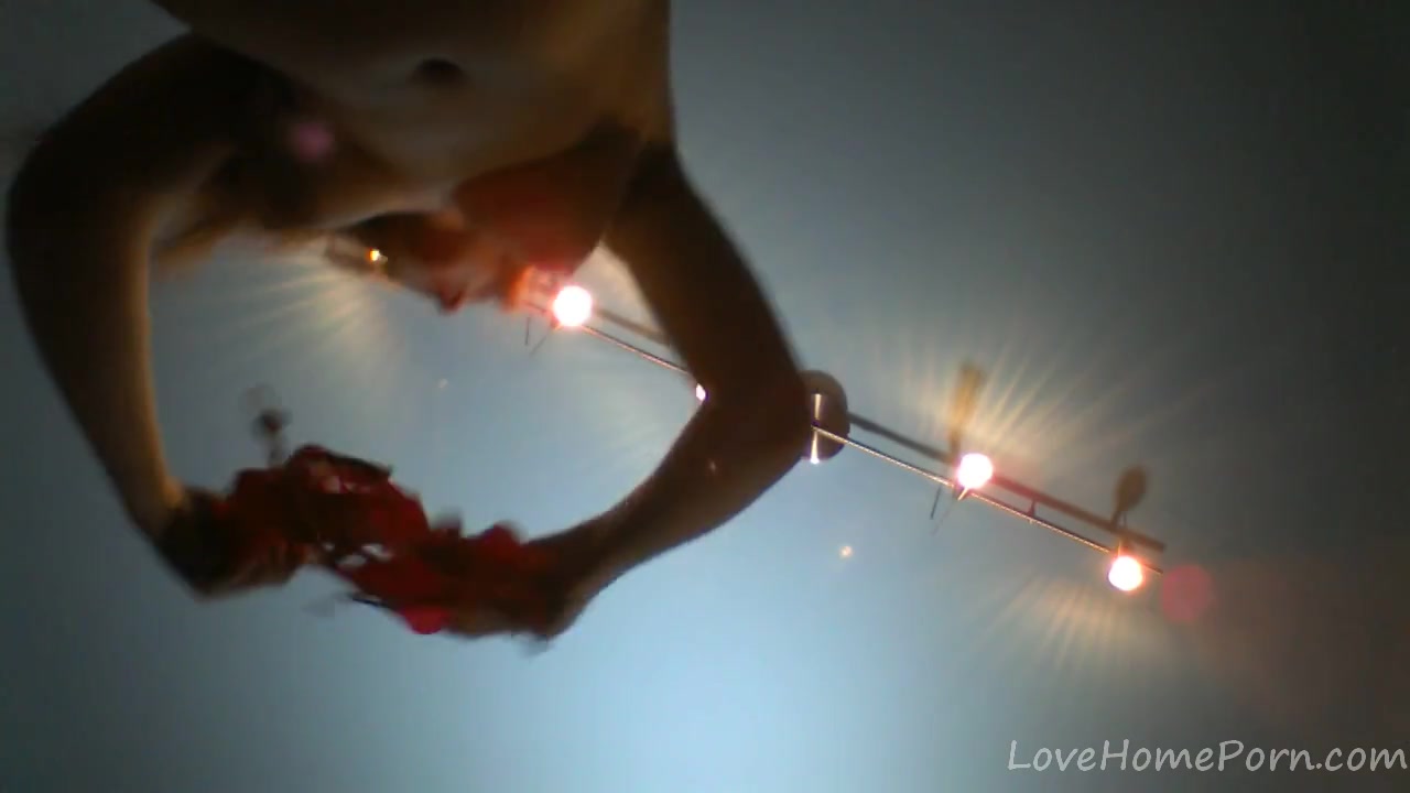 Redhead in a red dress rubs her pussy