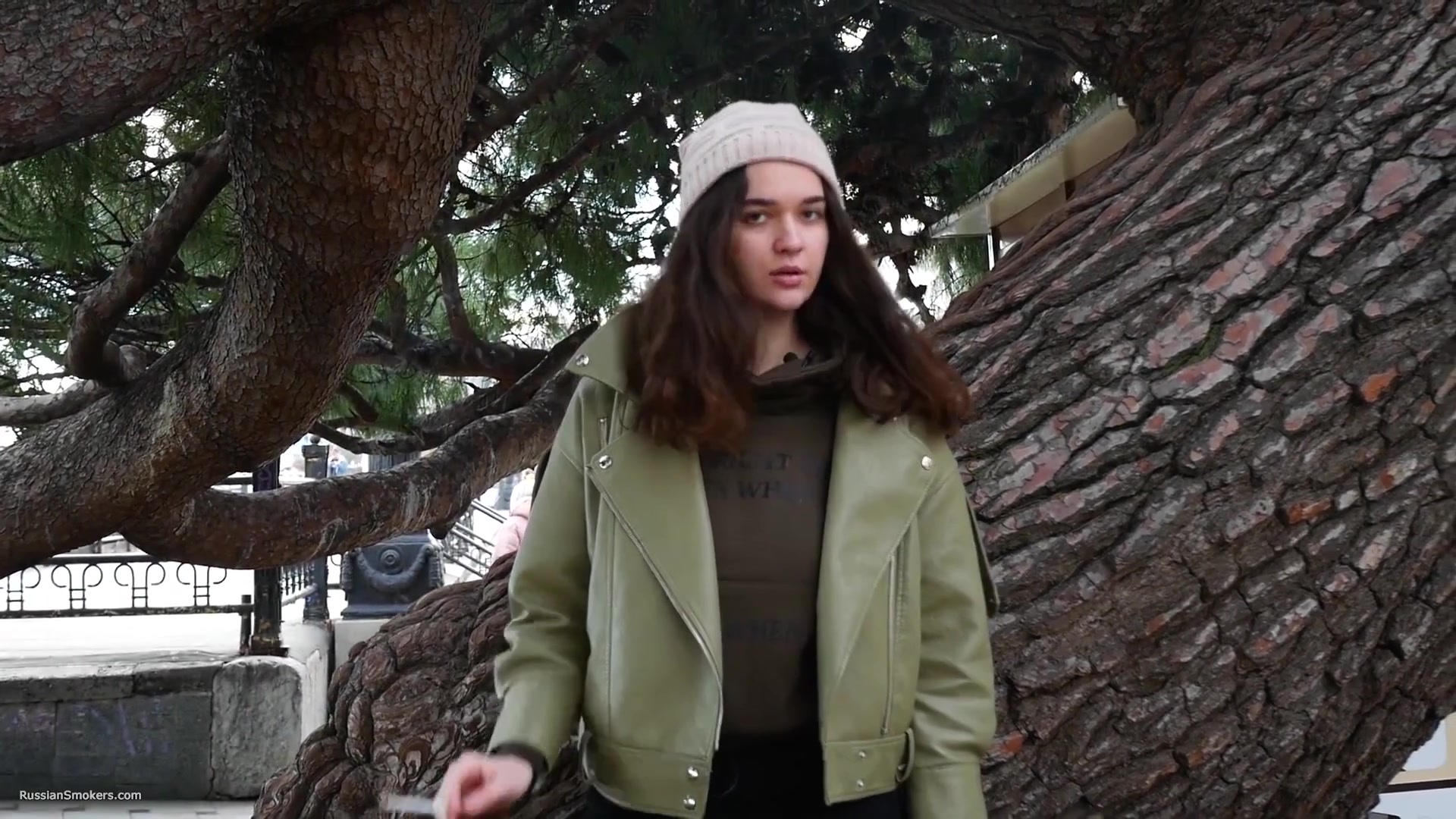 Young Brunette Is Taking An Unhurried Stroll With Allwhite 120mm Cigarette