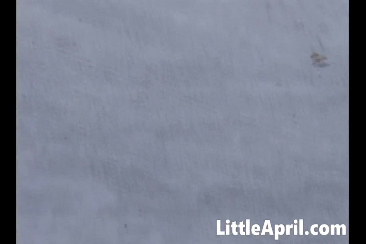 Little April masturbates in hot solo scene