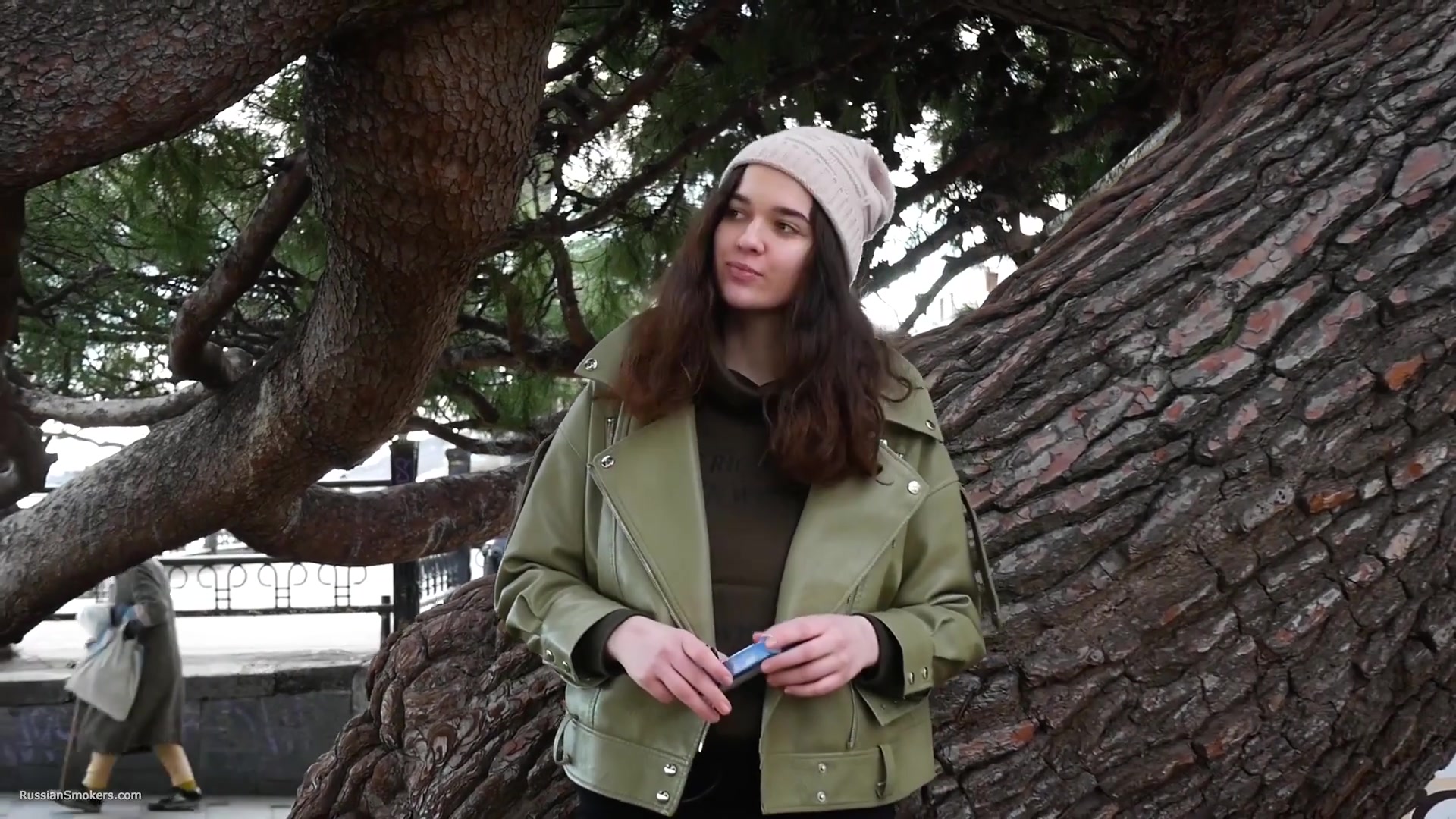 Young Brunette Is Taking An Unhurried Stroll With Allwhite 120mm Cigarette