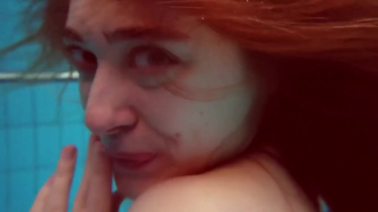 Dianas Redhead Beauty Enhances Her Swimming Grace