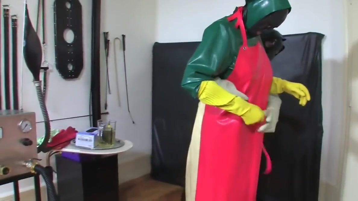 Bizarre rubber enema servant 2 of 5