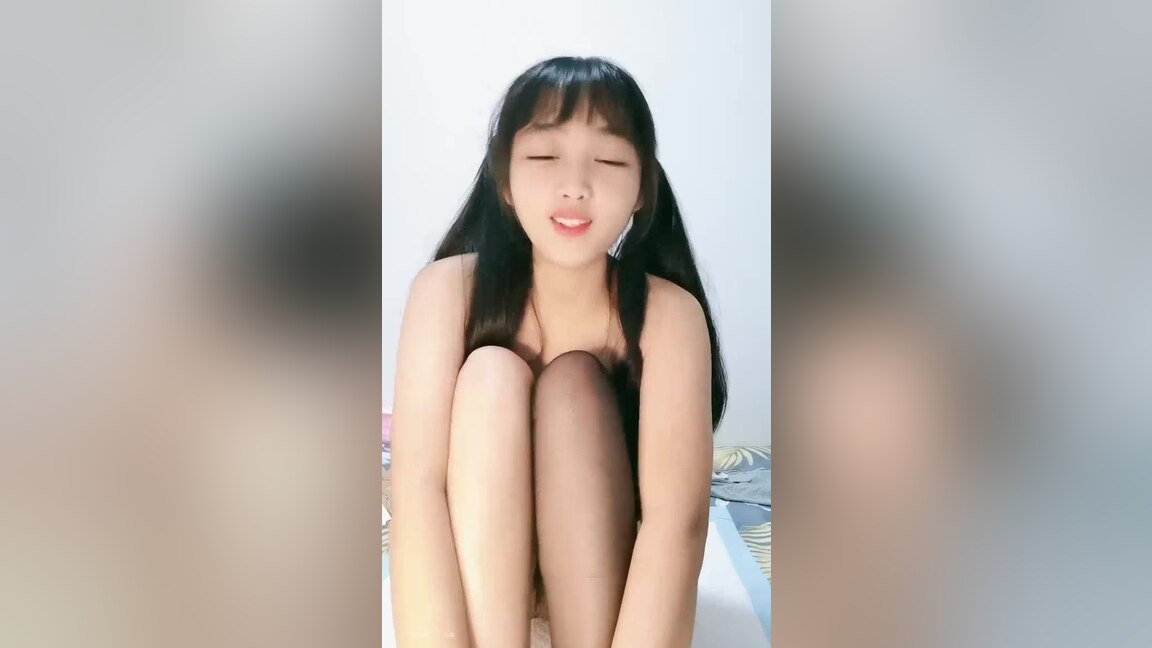 Asian MILF gets fucked by a white skunk on camera.