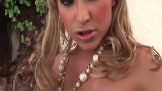 Blonde tranny in latex boots jerking off