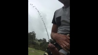 Aussie Pissing Outdoors While Rock Hard