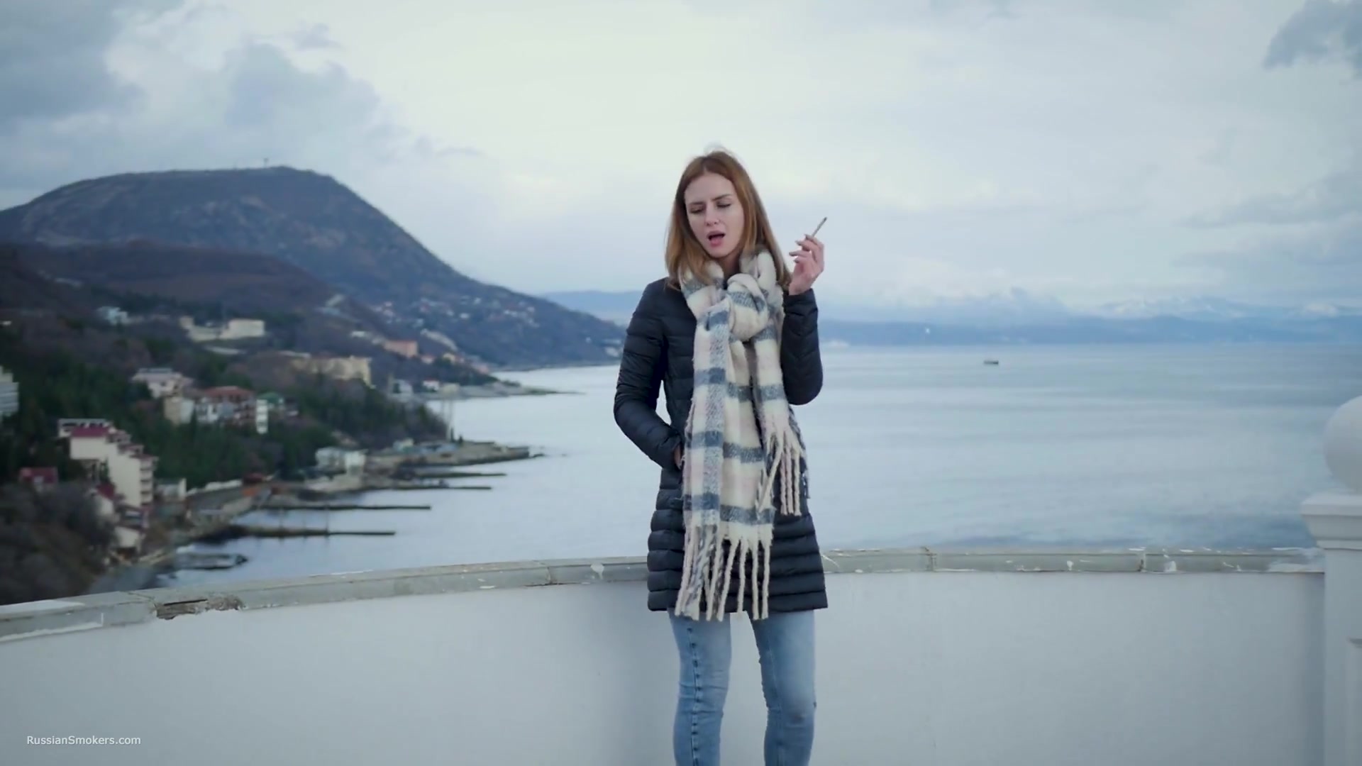 Beautiful Lady Is Smoking Two Saratoga Cigarettes In A Row On A Beautiful View