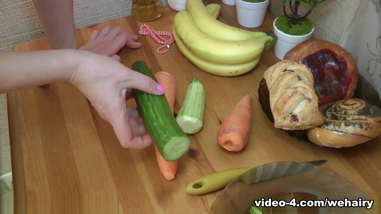 Dina has fun masturbating in her kitchen