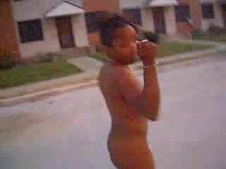 Curly black slut walks naked around the neighborhood