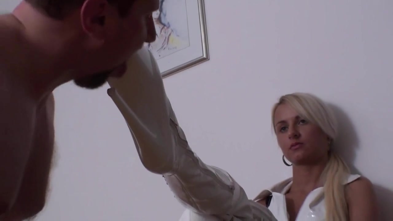Slave licks her mistress's white high heels by Femdom Austria