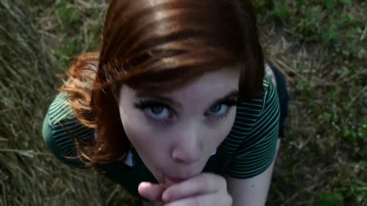 18 year old redhead sucking dick on an open field