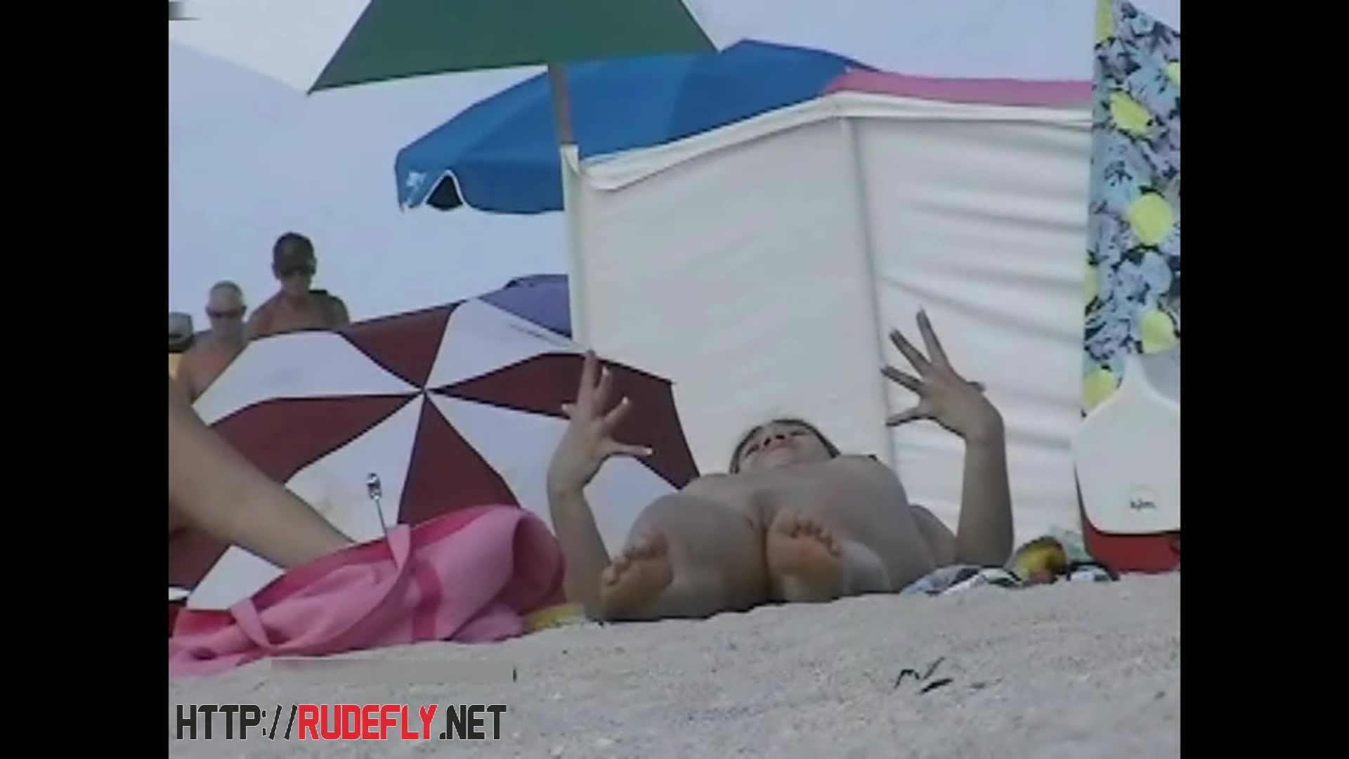 Beach beauties hang out naked below the sun