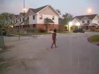 Curly black slut walks naked around the neighborhood