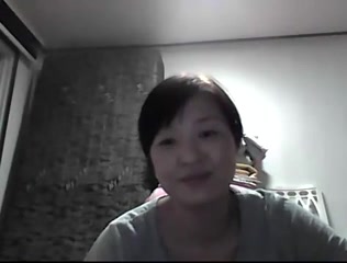 Wonderful mature Asian wife flashing her tits on camera