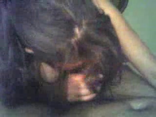 Long-haired brunette sucking on cock like it's her last time