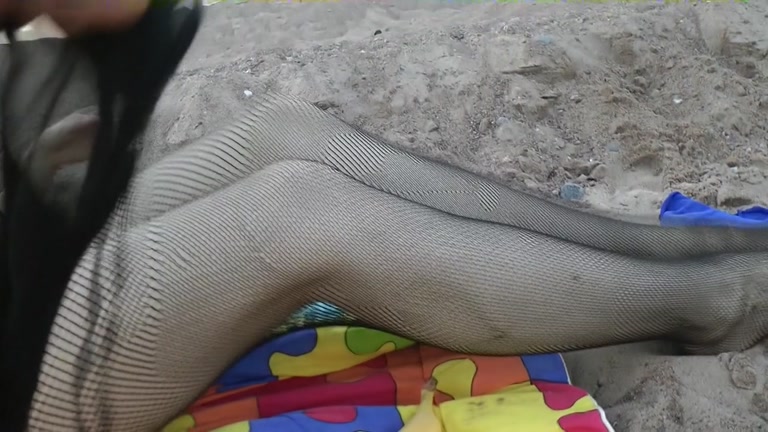 Girl in fishnets blowing