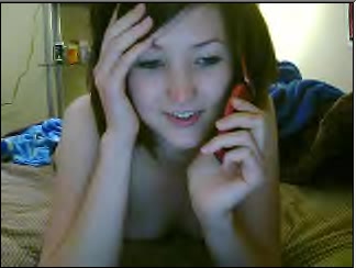 Playful girlfriend phone sexing with her boyfriend