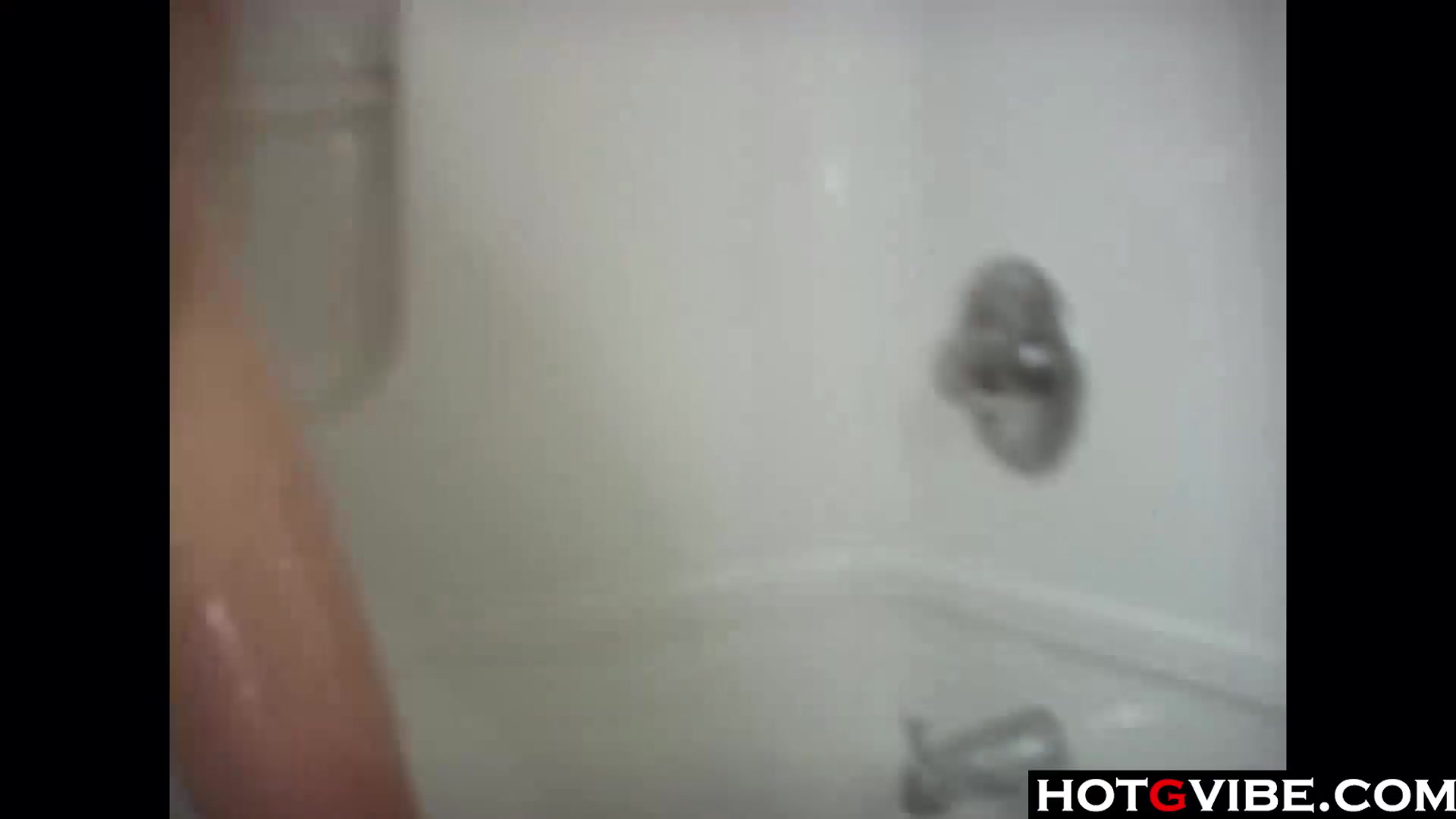 Sexy Brunette takes a shower and plays with her pussy