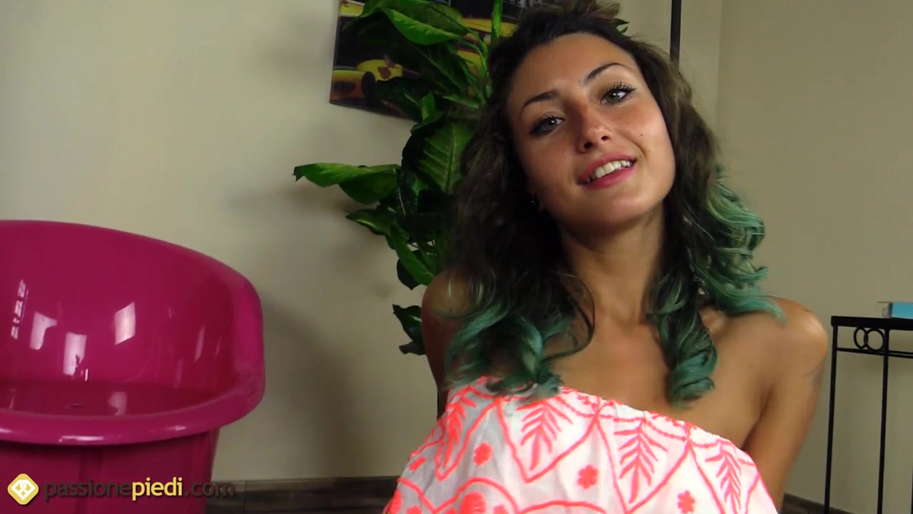 Frisky Thena spraying streamers on her bare feet