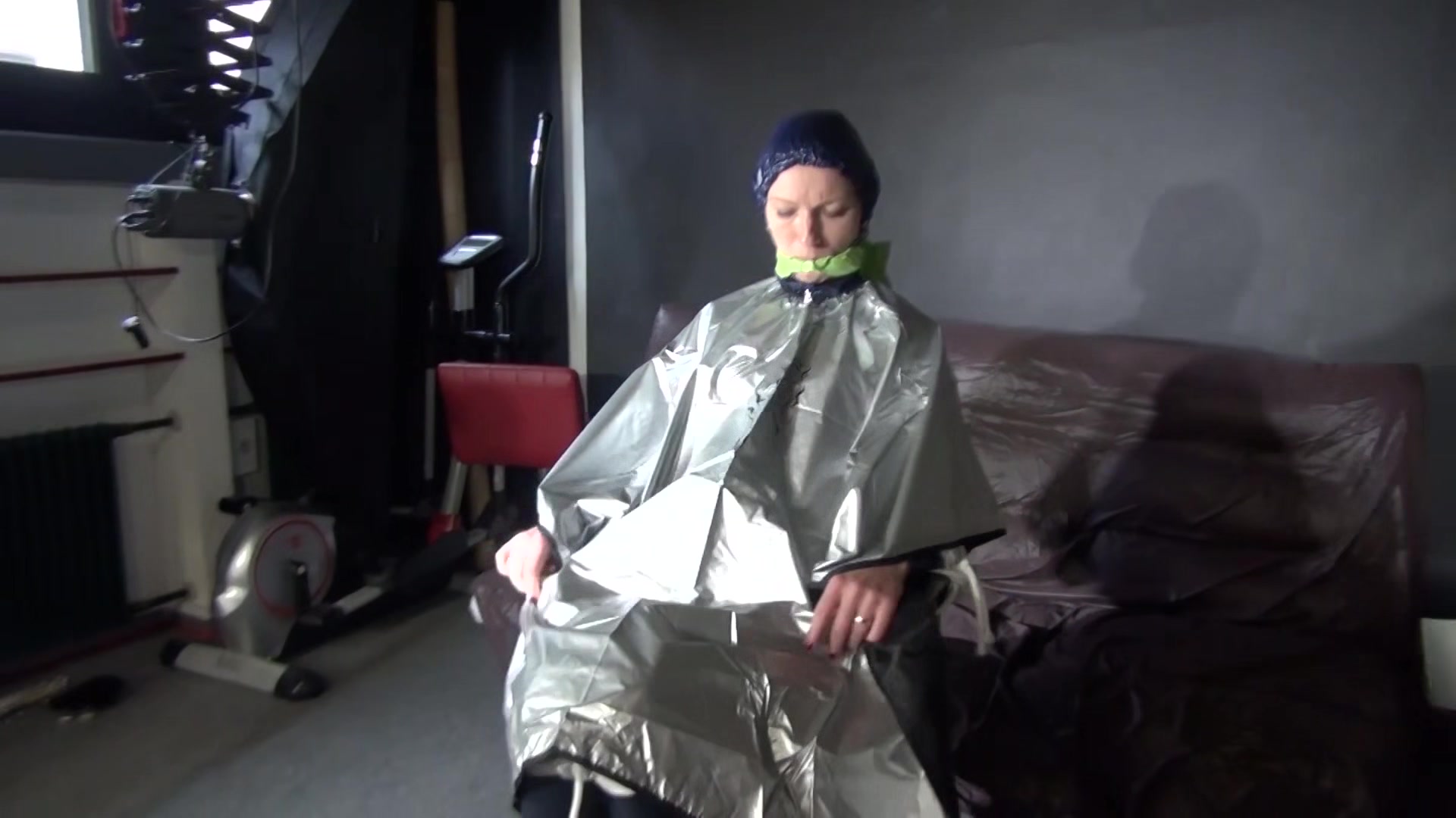 Sexy Ronja Being Tied, Gagged And Hooded On A Chair With A Clothgag Wearing Sexy Blue Shiny Nylon Rainwear (Video)