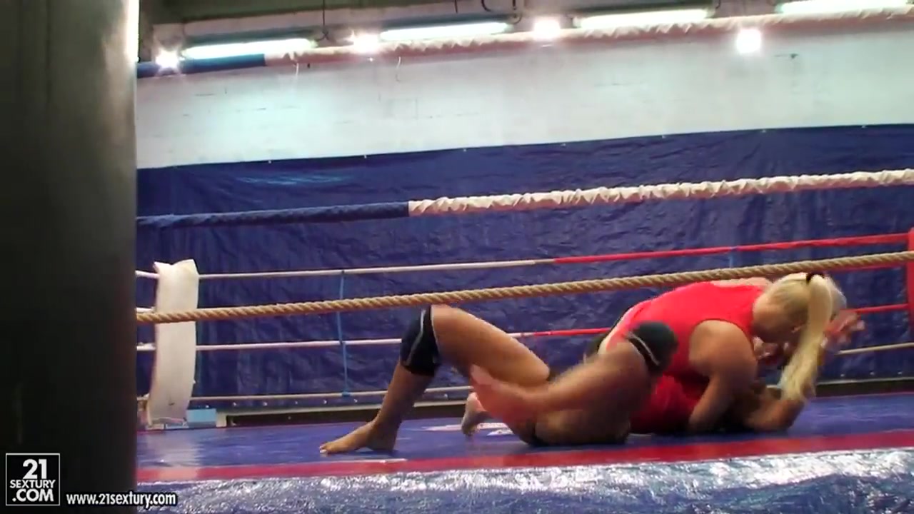 Brandy Smile wrestles with Lionses in the ring